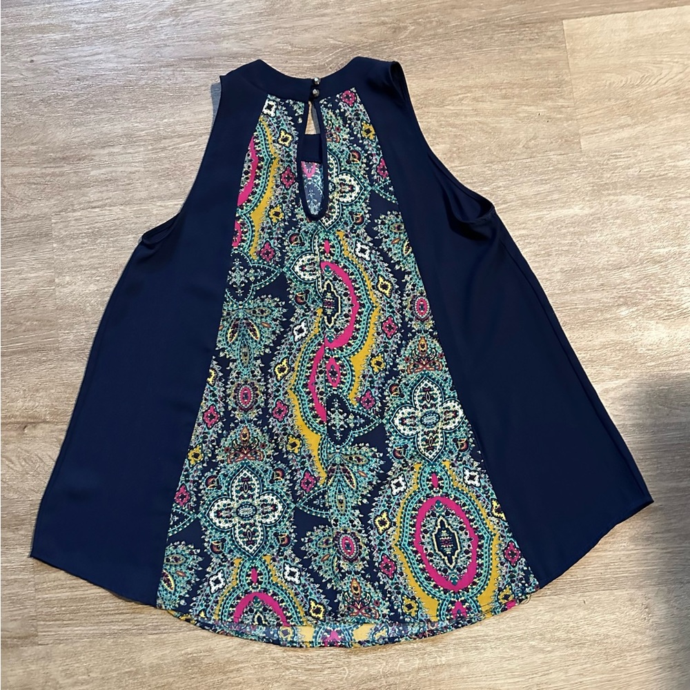 Blue Rain sleeveless flare top. Size Medium. Navy blue & multi-colored design.